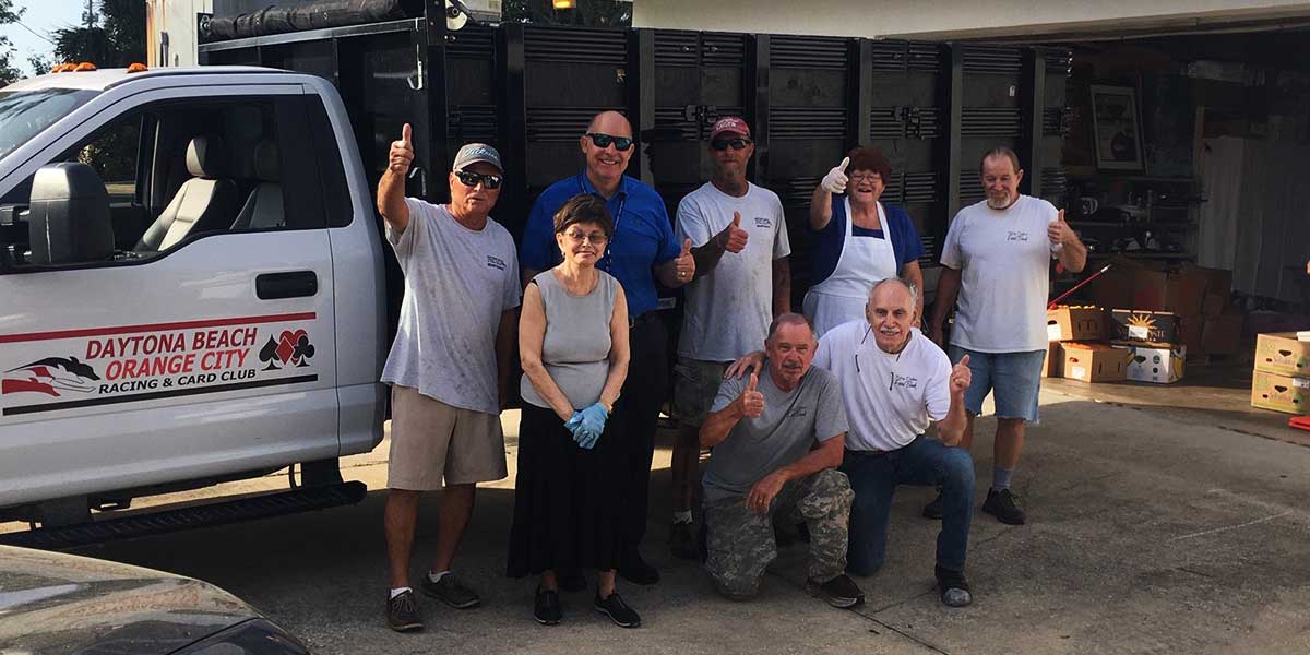 Daytona Beach Racing & Card Club staff preparing community food donations