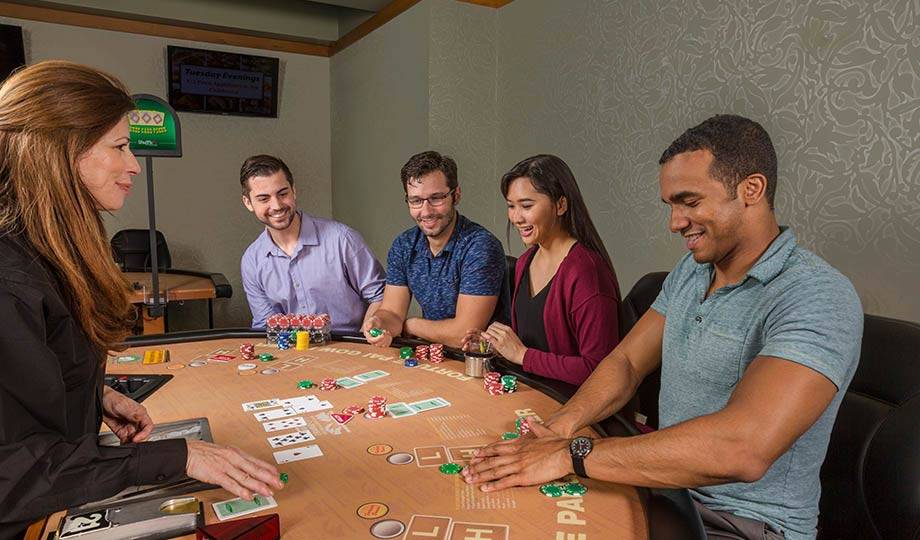 Poker players around table, Vegas Style Poker, Daytona Beach Racing & Card Club